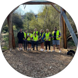 Service and Sales team in high vis in a local park clearing up rubbish for charity 'Turn the Tide' in honour of International Day of Biodiversity