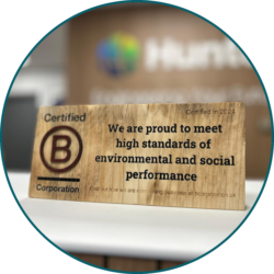 B Corp certification plaque displayed in an office highlighting environmental and social performance standards.